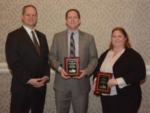 EN President and CEO Kevin Kissling (left) presents Dedicated Service Awards to Donald Leadbetter and Alexa Viets.
